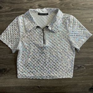 Holographic dolls kill top